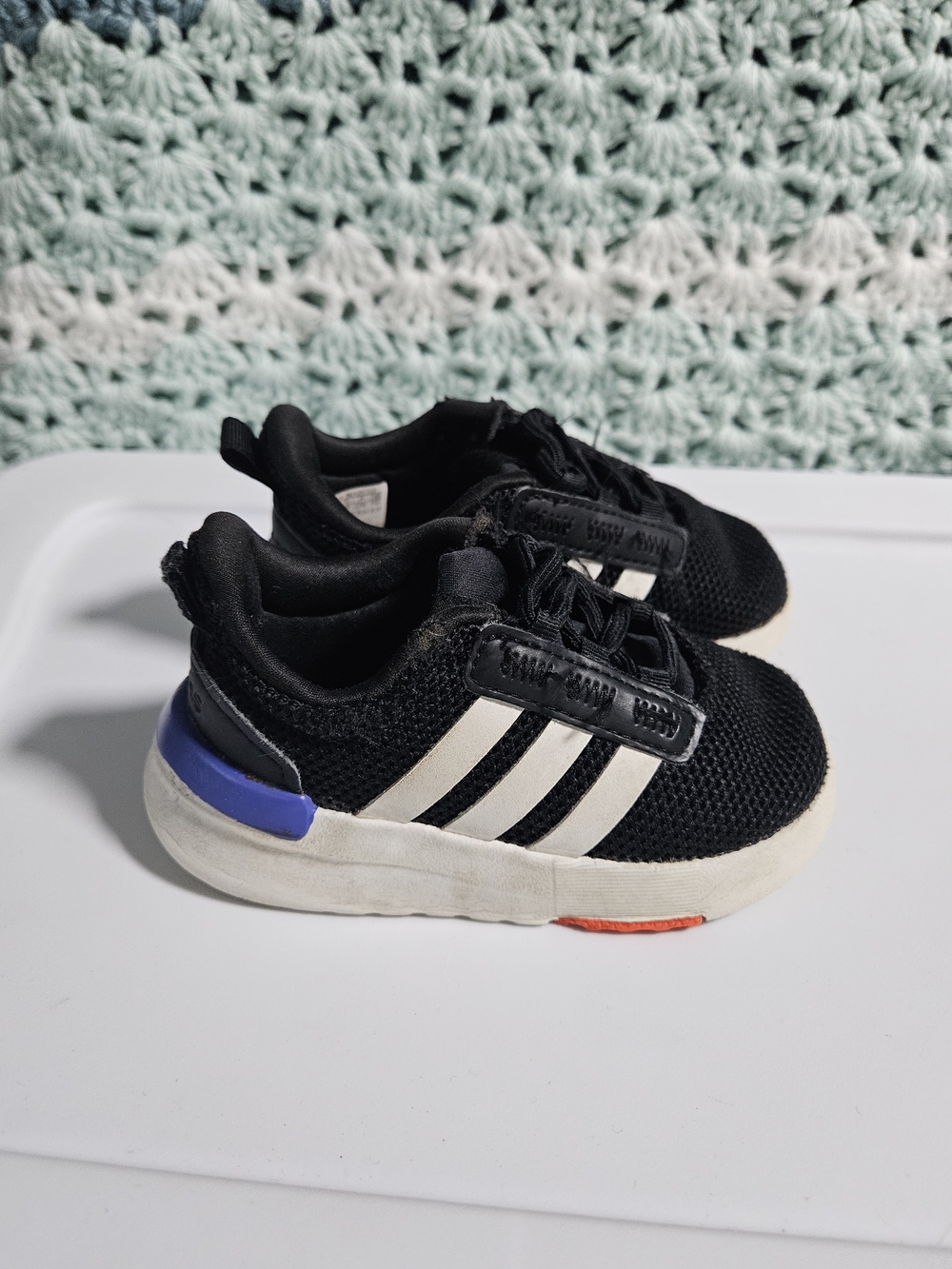 adidas Black Sneakers with White Stripes and Blue Heel Accent